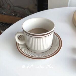 Striped White and Brown Cup and Saucer Set